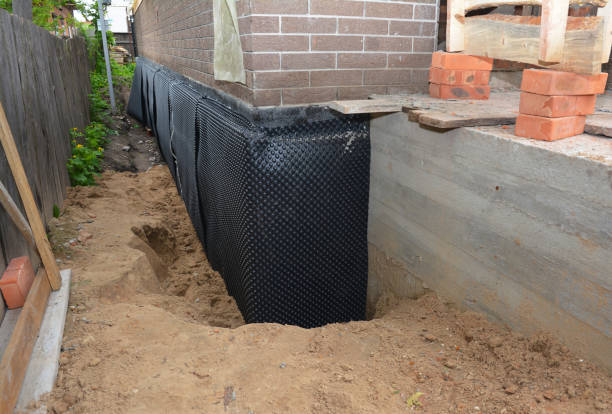Happy homeowners after waterproofing job in Wharton